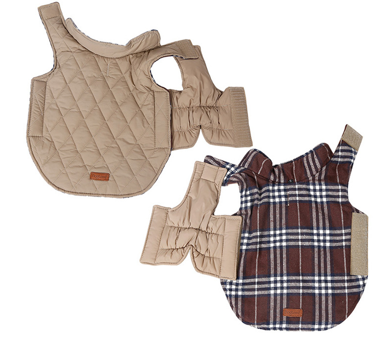 Inside view of reversible dog jacket showing beige quilted lining and elastic leg openings, with brown plaid flannel exterior visible underneath