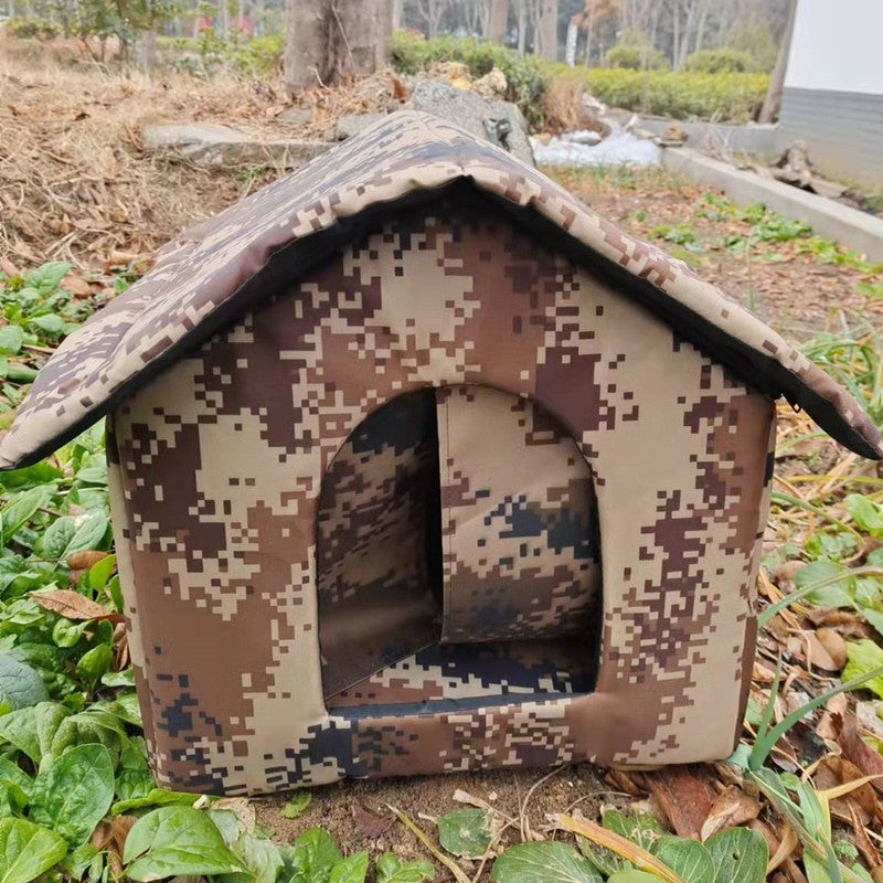 Brown tan Digital Desert Camouflage design foldable outdoor pet house placed in garden with green plants
