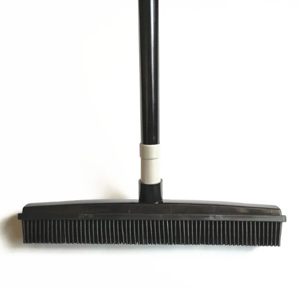 Black broom with a white handle on a white background