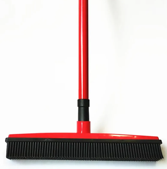 Red and black broom on a white background