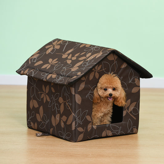 Small fluffy Poodle peeking out of brown Leaves design foldable indoor pet house on wood floor