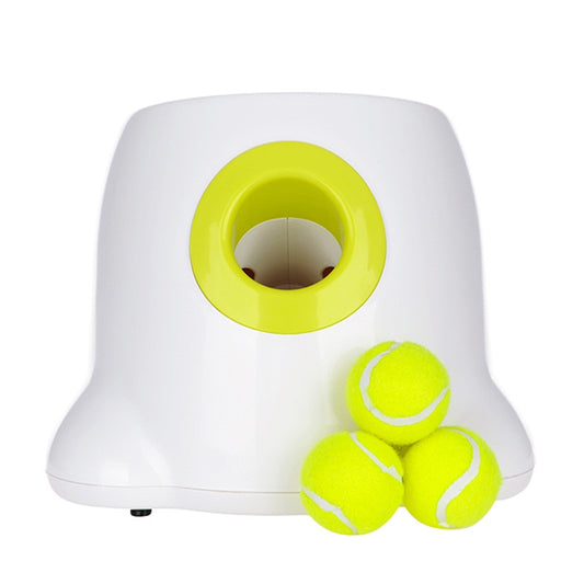 White and yellow tennis ball launcher with three tennis balls on a white background